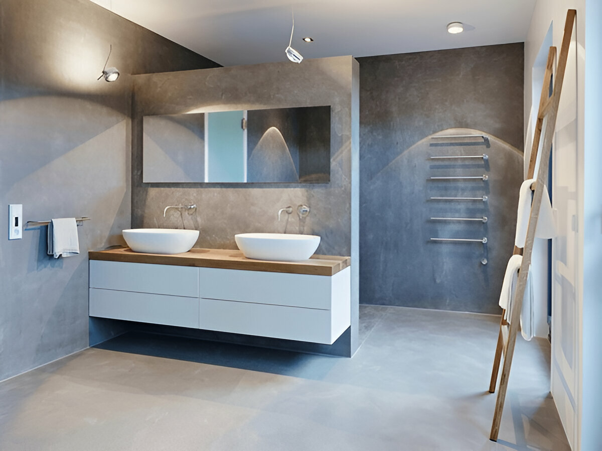 Minimalist bathroom with floating double vanity, vessel sinks, and concrete finishes.