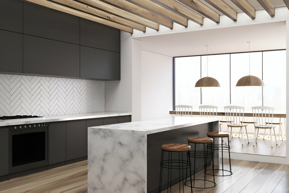 Sleek modern kitchen featuring a marble waterfall island and herringbone tile backsplash
