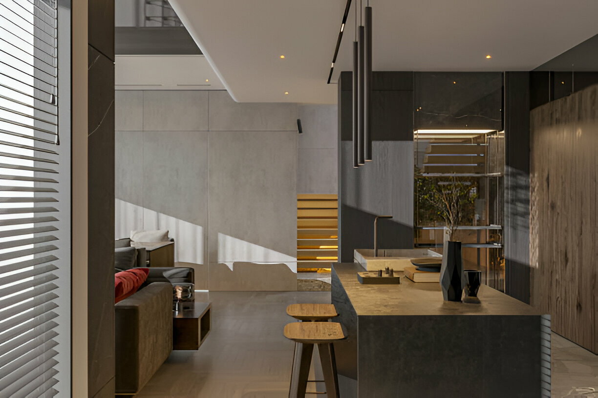 Contemporary kitchen island with dark stone finish and minimal decor