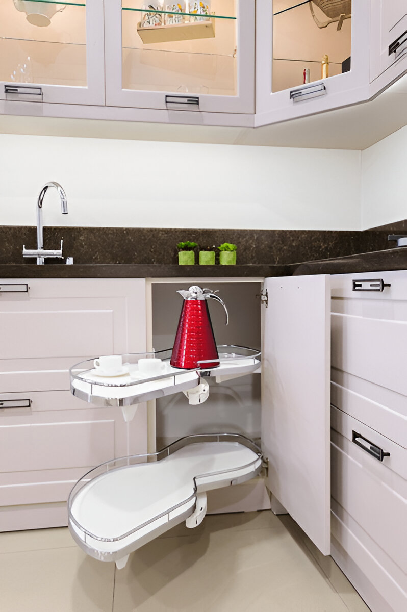 Corner kitchen cabinet with pull-out kidney-shaped shelves