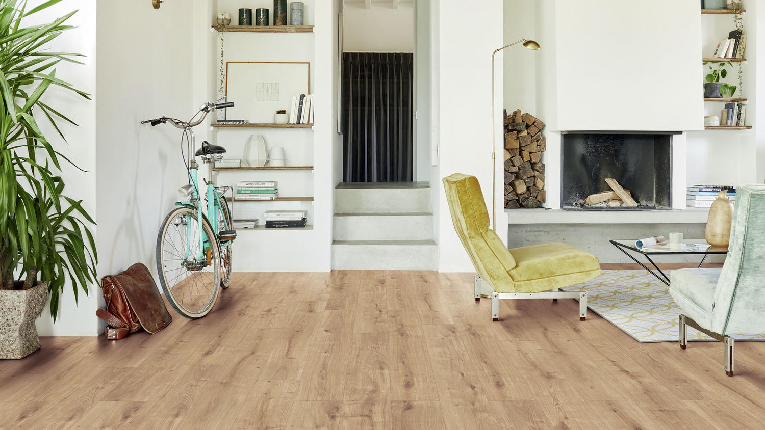 Bright living room with tundra oak laminate flooring, fireplace, indoor plants, and minimalist furniture