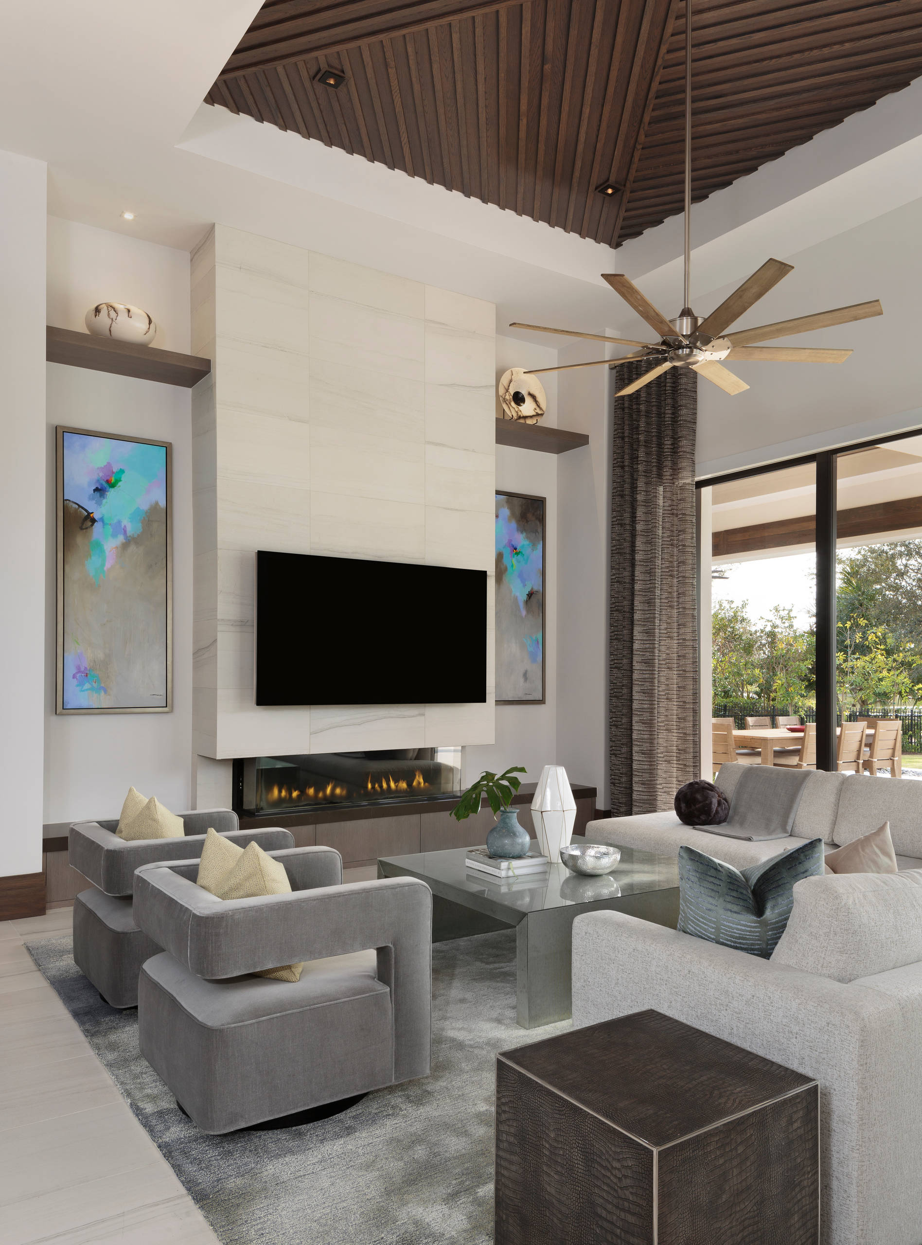 Modern living room with sleek fireplace, TV wall, and contemporary furniture