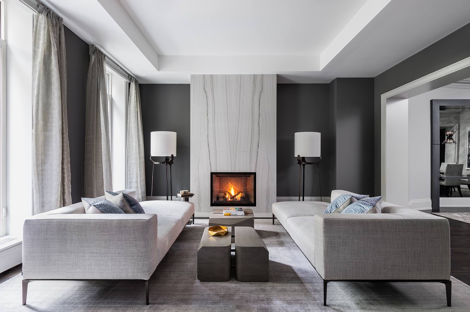 Modern minimalist living room with sleek fireplace and neutral tones