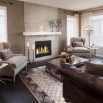Cozy living room with modern fireplace, classic armchairs, and elegant décor